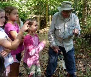 Dr. Grant show kids a spider