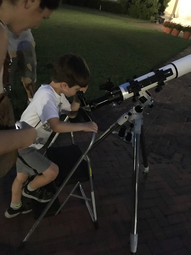 Child with telescope