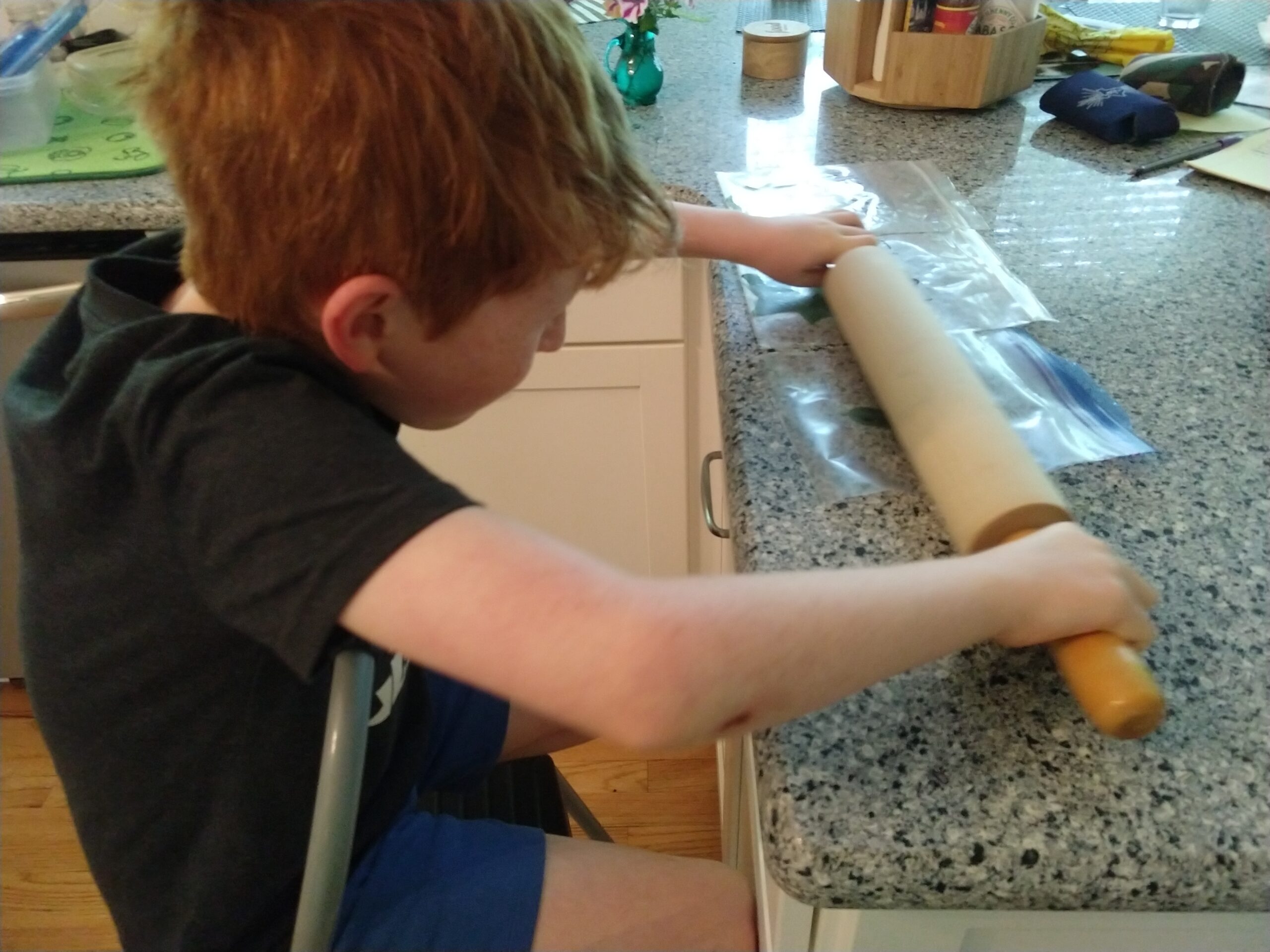 Using rolling pin to crush leaves